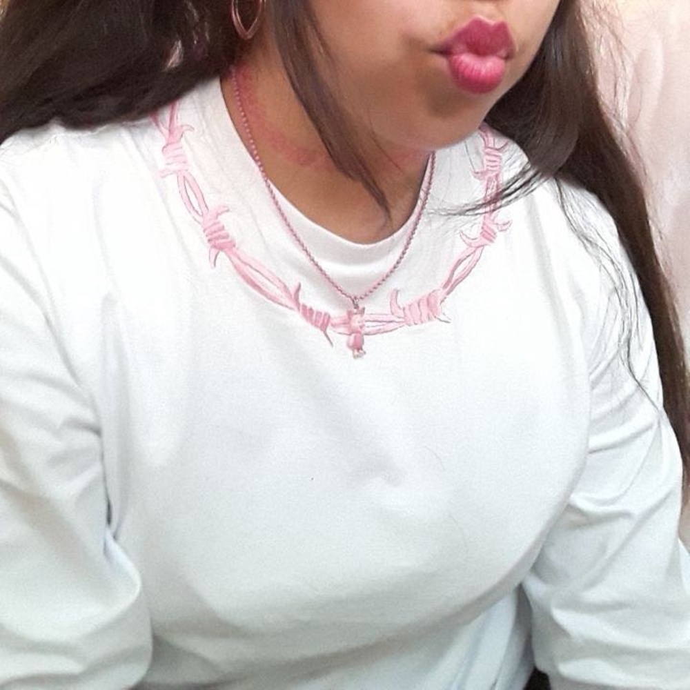 white crew neck long sleeve pullover with pink embroidery